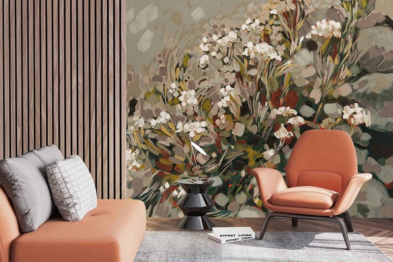 The wallpaper showcases a large, vibrant floral pattern with rich orange tones, hints of gray and white accents, set against a modern warm backdrop. Perfect for creating an inviting atmosphere in contemporary living spaces.