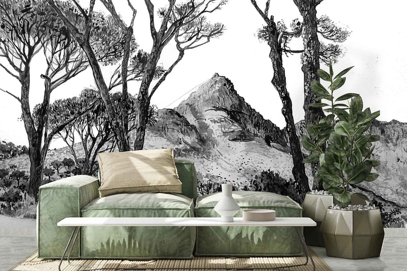 Black and white mural features tree silhouettes and a mountain landscape.