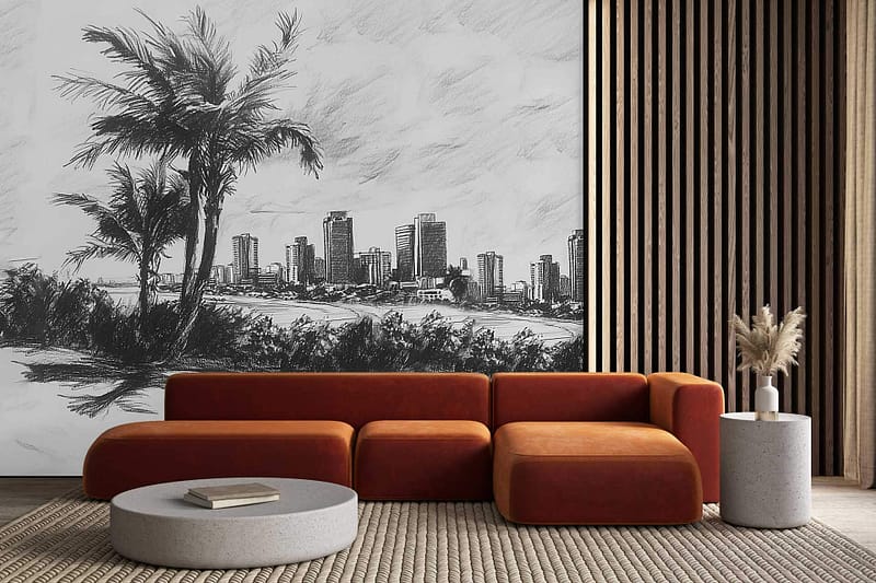 The wallpaper is a wall-sized monochrome mural depicting a dawn-lit city skyline. It features outlines of urban buildings and silhouettes of palm trees, creating an illusion of depth. The colors are primarily shades of gray and black, evoking a tranquil early morning atmosphere.