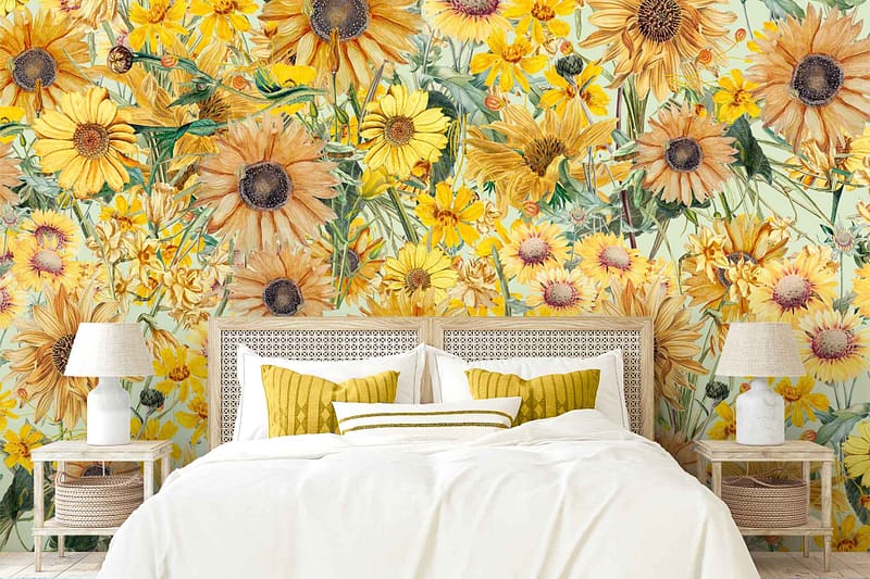 Wallpaper features vibrant sunflowers and daisies in yellow and white hues, adding a lively, cheerful touch to the wall behind the bed.