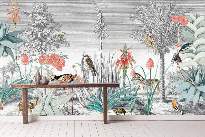 The wallpaper features a vibrant, tropical scene with lush green plants, colorful flowers in shades of red, pink, and orange, animals such as monkeys and leopards, and exotic birds with bright plumage in hues of blue and yellow. The mural adds an enchanting touch with its dynamic composition and vivid colors.