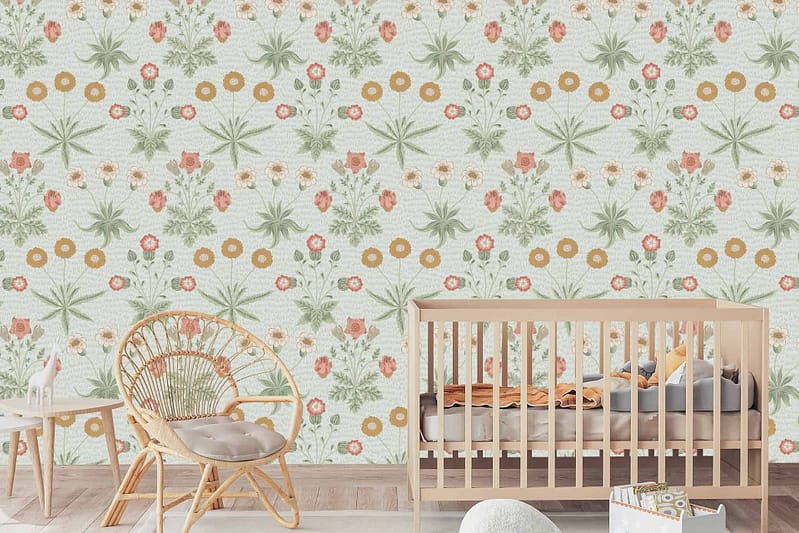 Sarah's nursery wallpaper features green and orange flowers, showcasing a floral theme.