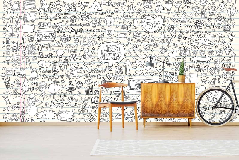 The wallpaper features whimsical hand-drawn doodles including hearts, stars, arrows, flowers, and various words and phrases. The colors on the wallpaper incorporate a mix of vibrant and subtle tones to create an artistic effect.