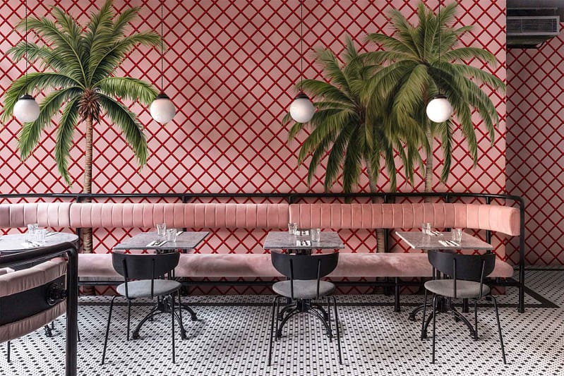 Red and white lattice-patterned wall, palm tree murals