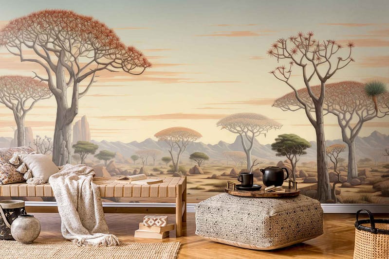 A serene living room is adorned with desert-inspired wallpaper, showcasing large, unique Namibian trees and distant mountains. The wallpaper features warm earth tones, including sandy beiges, dusky pinks, and rich browns. Elements like towering acacias and rugged mountain silhouettes create an exotic backdrop that evokes the tranquil and vast landscapes of Namibia. This distinctive design brings natural beauty indoors while complementing the cozy furnishings for a travel-themed ambiance.