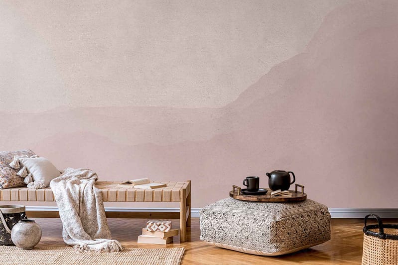 The wallpaper features a subtle abstract mountain design with soft curvature, incorporating muted tones such as gentle grays, mild beiges, and light taupes. The overall effect is serene and harmonious.