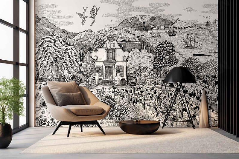 A modern living room showcases a black and white mural with intricate details of a scenic landscape. Key elements include a colonial-style house, lush gardens, mountains, birds, and ships at sea. The mural is monochromatic, featuring shades from deep blacks to crisp whites.