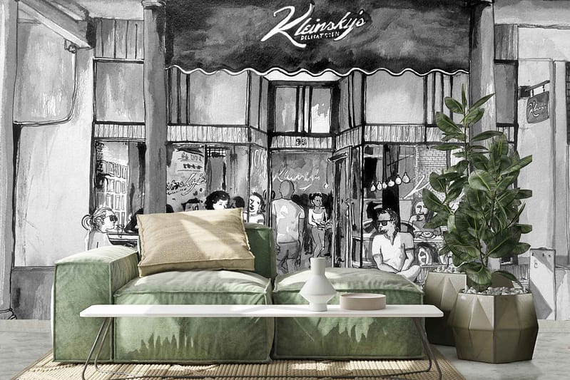 The ParkWall mural is a black-and-white depiction featuring people gathered at the entrance of a deli. It captures dynamic urban elements like bustling figures and storefront details, with high contrast between deep blacks and bright whites. The monochromatic palette highlights textures and patterns found in city life scenes.