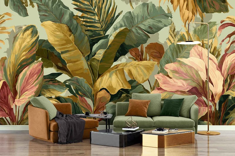 Large wall mural features vibrant tropical leaves with bold green, yellow, and pink colors. The design includes oversized palm fronds, monstera leaves, and banana leaf shapes overlapping in a colorful pattern. Tropical foliage motif stands out with lush greens accented by sunny yellows and soft blush pinks on a light background.